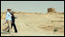 Mrs. Laura Bush and Mrs. Aliza Olmert walk a path at Masada National Park Thursday, May 15, 2008, during a tour of the historic site with their spouses.