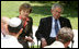 President George W. Bush and Mrs. Laura Bush listen to as a young participant during a roundtable discussion Friday, May 16, 2008, at the Bible Lands Museum Jerusalem. On the topic of peace with the Palestinians, the young student said, "I’m religious, but I want to give the Arabs land,’’ he said. "I feel I have a good life. Why don’t they get a good life too?"