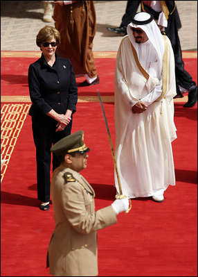 Mrs. Laura Bush and President Bush are greeted by Saudi delegation members during arrival ceremonies Friday, May 16, 2008, at Riyadh-King Khaled International Airport in Riyadh.