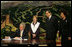 President George W. Bush signs his condolences for the victims of China's May 12, earthquake as he and Mrs. Laura Bush visit the Embassy of the People's Republic of China Tuesday, May 20, 2008, in Washington, D.C. With them are China's Ambassador to the United States Wenzhong Zhou and his spouse, Shumin Xie.