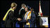 Mrs. Laura Bush congratulates a graduate during commencement exercises Thursday, May 29, 2008, at Enterprise High School in Enterprise, Alabama. Mrs. Bush was on hand to deliver the commencement address, and she told the class -- that lost four of its members in deadly tornadoes last year -- and told the Class of 2008, "As you graduate tonight, take with you memories of your teachers' and classmates' support after the storm, the blue and white worn by students at rival schools, and the donations that came pouring in from around the country."