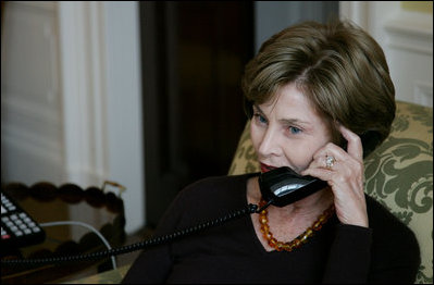 Mrs. Laura Bush speaks on the phone with Michelle Obama Wednesday, Nov. 5, 2008 in the family residence at the White House. Mrs. Bush assured Mrs. Obama that they will enjoy living at the White House, and that it is a wonderful place to raise a family. Also Mrs. Bush extended an invitation to the Obama family to visit the White House.