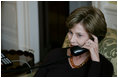 Mrs. Laura Bush speaks on the phone with Michelle Obama Wednesday, Nov. 5, 2008 in the family residence at the White House. Mrs. Bush assured Mrs. Obama that they will enjoy living at the White House, and that it is a wonderful place to raise a family. Also Mrs. Bush extended an invitation to the Obama family to visit the White House.