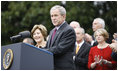 With Mrs. Laura Bush, the Vice President and Mrs. Cheney and Cabinet secretaries looking on, President George W. Bush addresses his staff Thursday, Nov. 6, 2008, on the South Lawn of the White House. Said the President, "As we head into this final stretch, I ask you to remain focused on the goals ahead. I will be honored to stand with you at the finish line."