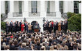 President George W. Bush speaks to employees of the Executive Office of the President Thursday, Nov. 6, 2008, about the upcoming transition. In thanking the staff, the President said, "The people on this lawn represent diverse backgrounds, talents, and experiences. Yet we all share a steadfast devotion to the United States. We believe that service to our fellow citizens is a noble calling -- and the privilege of a lifetime."