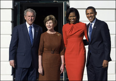 President George W. Bush and Mrs. Laura Bush and President-elect Barack Obama and Mrs. Michelle Obama pause for photographs Monday, Nov. 10, 2008, after the Obama's arrival at the South Portico of the White House.