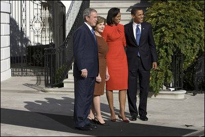 President George W. Bush and Mrs. Laura Bush welcome President-elect Barack Obama and Mrs. Michelle Obama to the White House Monday, Nov. 10, 2008, after the couple's South Portico arrival.