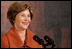 Mrs. Laura Bush delivers remarks during the Coming Up Taller Awards Friday, Nov. 14, 2008, in the East Room of the White House. Mrs. Bush stated during her remarks, "Congratulations to all the recipients of the 2008 Coming Up Taller Awards! Because of the programs you represent, young people are building the confidence to paint, dance, speak, sing and in every one of their communities, to walk taller. Thank you all very, very much."