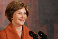 Mrs. Laura Bush delivers remarks during the Coming Up Taller Awards Friday, Nov. 14, 2008, in the East Room of the White House. Mrs. Bush stated during her remarks, "Congratulations to all the recipients of the 2008 Coming Up Taller Awards! Because of the programs you represent, young people are building the confidence to paint, dance, speak, sing and in every one of their communities, to walk taller. Thank you all very, very much."