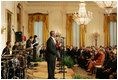 Mrs. Laura Bush listens as Berklee City Music group performs Friday, Nov. 14, 2008, during the Coming Up Taller Awards in the East Room of the White House.