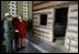 Mrs. Laura Bush tours a replica Log Cabin of Abraham Lincoln's Birthplace during her visit to the Abraham Lincoln Birthplace National Historic Site Tuesday, Nov. 18, 2008, in Hodgenville, KY. Mrs. Bush is led on the tour by Ms. Sandy Brue, Chief of Interpretation and Resource Management, Abraham Lincoln Birthplace National Historic Site.