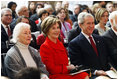 President George W. Bush and Mrs. Laura Bush smile as they participate Wednesday, Nov. 19, 2008, in the reopening of the National Museum of American History in Washington, D.C.