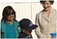 Mrs. Laura Bush and Ms. Nancy Quispitupa, Program Manager and Community Trainer, watch as 8-year-old William Sebastian Hernandez Jeri demonstrates learned hand-washing techniques Friday, Nov. 21, 2008, at the San Clemente Health Center in San Clemente, Peru. The center is the town's major health provider and serves an average of 80 patients per day.