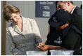 Mrs. Laura Bush looks on Friday, Nov. 21, 2008, as Ms. Maria Salguero Trillo, Community Health Educator Volunteer at the San Clemente Health Center in San Clemente, Peru, demonstrates how families are trained to treat contaminated water for safe drinking. In the town of 25,000, nearly 89 percent of the homes were affected by the August 2007, 8.0-magnitude earthquake.