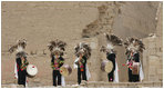 Greeters in traditional clothing welcome the APEC spouses to the Pachacamac Archaeological Site in Lurin, Peru, Saturday, Nov. 22, 2008, during the APEC spouses program. The site is home to the temples of the deity, Pachacamac, who was adored by Andean civilizations as the creator of the universe. Pachacamac means: "He who enlivens the universe."