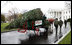 Sue Harman drives a horse-drawn carriage delivering the official White House Christmas tree Sunday, Nov. 30, 2008, to the North Portico of the White House. The Fraser Fir tree, from River Ridge Farms in Crumpler, N.C., will be on display in the Blue Room of the White House for the 2008 Christmas season.