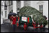 Mrs. Laura Bush delivers remarks as she stands with the White House Christmas tree Sunday, Nov. 30, 2008, in front of the North Portico of the White House. The Fraser Fir tree, from River Ridge Farms in Crumpler, N.C., will be on display in the Blue Room of the White House for the 2008 Christmas season.