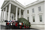 Mrs. Laura Bush welcomes the arrival of the official White House Christmas tree Sunday, Nov. 30, 2008, to the North Portico of the White House. The Fraser Fir tree, from the River Ridge Farms in Crumpler, N.C., will be on display in the Blue Room of the White House for the 2008 Christmas season. Joining Mrs. Bush, from left are, Mark Steelhammer, president of National Christmas Tree Association, his wife Luanne, Carol Pennington, Ann Estes, Russell Estes of River Ridge Farms in Crumpler, NC, Michelle Davis, and Jessie Davis of River Ridge Farms in Crumpler, NC.