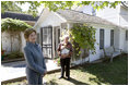 Mrs. Laura Bush talks with press outside the Mansfield, Mo., home of author Laura Ingalls Wilder after Mrs. Jean Coday, Director and President of the Laura Ingalls Wilder Historic Home and Museum, offered the First Lady a tour of the modest home. The home was designated this week as a Save America's Treasures project, which is in partnership with the National Trust for Historic Preservation. Mrs. Bush noted that Wilder, who wrote the "Little House" book series, was one of her favorite authors. "My mother read them to me when I was little before I could read," she said.