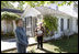 Mrs. Laura Bush talks with press outside the Mansfield, Mo., home of author Laura Ingalls Wilder after Mrs. Jean Coday, Director and President of the Laura Ingalls Wilder Historic Home and Museum, offered the First Lady a tour of the modest home. The home was designated this week as a Save America's Treasures project, which is in partnership with the National Trust for Historic Preservation. Mrs. Bush noted that Wilder, who wrote the "Little House" book series, was one of her favorite authors. "My mother read them to me when I was little before I could read," she said.