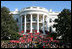 President George W. Bush joined by Mrs. Laura Bush receives applause during his remarks to the members of the 2008 United States Summer Olympic and Paralympic Teams Tuesday, Oct. 7, 2008, on the South Lawn of the White House. President Bush said, "You amazed the world with your talent and grace and sportsmanship. You inspired children to chase their dreams. You will be champions forever."