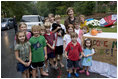 Mrs. Laura Bush stops and poses with children at their lemonade stand during her visit to Charlotte, N.C., Friday, October 10, 2008.