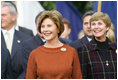 Mrs. Laura Bush and Mrs. Deborah Mullen, wife of the Chairman of the Joint Chiefs of Staff, Admiral Mike Mullen, watch the White House South Lawn ceremonies Oct. 13, 2008, for the State Arrival of Italian Prime Minister Silvio Berlusconi.