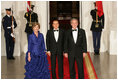 President George W. Bush and Mrs. Laura Bush welcome Italian Prime Minister Silvio Berlusconi Monday evening, Oct. 13, 2008, to the North Portico of the White House for a State Dinner in his honor.