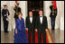 President George W. Bush and Mrs. Laura Bush welcome Italian Prime Minister Silvio Berlusconi Monday evening, Oct. 13, 2008, to the North Portico of the White House for a State Dinner in his honor.