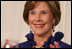 Mrs. Laura Bush applauds Italian Prime Minister Silvio Berlusconi as he his praised in an address by President George W. Bush Monday evening, Oct. 13, 2008, during the White House State Dinner in Berlusconi's honor.