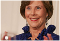 Mrs. Laura Bush applauds Italian Prime Minister Silvio Berlusconi as he his praised in an address by President George W. Bush Monday evening, Oct. 13, 2008, during the White House State Dinner in Berlusconi's honor.