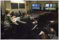 Joined by U.S. Secretary of Commerce Carlos Gutierrez, right, Mrs. Laura Bush talks with the Ladies in White via a video teleconference Thursday, Oct. 16, 2008, in the Situation Room of the White House. The Ladies in White is an organization that includes spouses and other relatives of jailed Cuban dissidents. The organization was formed in 2003 to protest the arrest of 75 dissidents by the Cuban regime. Members of the organization have been consistently detained, threatened, and at times beaten by police during their peaceful protests.