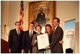 Mrs. Laura Bush presents the Fifth Annual Preserve America History Teacher of the Year award to David Mitchell, right, Friday, Oct. 24, 2008, at the Union League Club in New York City. She is joined by Dr. James Basker, President, Gilder Lehrman Institute of American History, left, and David Mitchell's students from Masconomet Regional High School in Boxford, Mass., David Burbank, 17, and Molly Byman, 18. The award notes the importance of teaching history and highlights the Preserve America initiative.