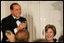 Prime Minister Silvio Berlusconi of Italy, seated next to Mrs. Laura Bush, acknowledges a toast offered in his honor by President George W. Bush Monday eveing, Oct. 13, 2008, at the White House State Dinner in honor of Berlusconi's visit to Washington, D.C.