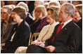 President George W. Bush and Mrs. Laura Bush listen Monday evening, Oct. 27, 2008 in the East Wing of the White House, to the performance of Theodore Roosevelt impersonator Joe Wiegand, during a celebration of the 150th birthday of Theodore Roosevelt.