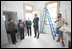 Mrs. Laura Bush is joined by homeowner Joretta Roman as she views the renovation project at Roman's home Thursday, October 30, 2008, in New Orleans, La., during a tour of the home being rennovated by Catholic Charities Operation Helping Hands. The home sustained damage during Hurricane Katrina.