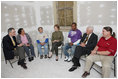 Mrs. Laura Bush visits with Mr. Jim Kelly, CEO and co-president of Catholic Charities Archdiocese of New Orleans, left; homeowner Mrs. Joeretta Roman, Ms. Nancy Parlin, Consociate Candidate, Sisters of St. Joseph of the Province of St. Paul, third from left; Mr. Ashton Johnson, student YouthBuild Helping Hands; Mr. Doug O'Dell, Federal Coordinator, Office of the Federal Coordinator for Gulf Coast Rebuilding, 2nd right, and Mr. Kevin Fitzpatrick, Volunteer Housing Coordinator, Operation Helping Hands, right, Thursday, October 30, 2008, in New Orleans, La., during a tour of the home of Joretta Roman which is being rennovated by Catholic Charities Operation Helping Hands after sustaining damage from Hurrican Katrina.