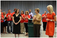 Mrs. Laura Bush and Mrs. Cindy McCain applaud the efforts of volunteers who are setting up a space in Minneapolis Convention Center Monday, September 1, 2008, to assemble and ship out care kits to support the victims of Hurricane Gustav.