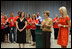 Mrs. Laura Bush and Mrs. Cindy McCain applaud the efforts of volunteers who are setting up a space in Minneapolis Convention Center Monday, September 1, 2008, to assemble and ship out care kits to support the victims of Hurricane Gustav.