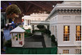 Mrs. Laura Bush peers through the windows of West Wing on a detailed recreation of the White House during a visit Tuesday, Sept. 2, 2008, to CivicFest: A Very Minnesota Celebration, at the Minneapolis Civic Center. Created by John and Jan Zweifel, the replica was created using photographs, published drawings and memories from frequent public tours and is part of a vibrant civic festival celebrating Minnesota and American history, democracy and the U.S. Presidency.