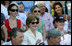 Mrs. Laura Bush is joined by her daughters, Barbara, background-left, and Jenna, background-right, as they watch action at the Tee Ball on the South Lawn: A Salute to the Troops game Sunday, Sept. 7, 2008 at the White House, played by the children of active-duty military personnel.