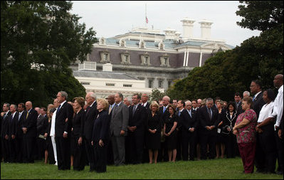 President George W. Bush and Mrs. Laura Bush stand with Vice President Dick Cheney and Mrs. Lynne Cheney and staff, family and friends Thursday, Sept. 11, 2008, in a South Lawn observance of the seventh anniversary of the September 11 terrorist attacks.