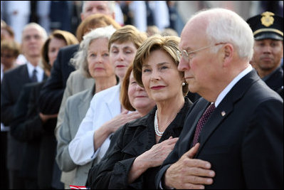 Mrs. Laura Bush stands with Vice President Dick Cheney during the National Anthem Thursday, Sept. 11, 2008, at the dedication ceremony for the 9/11 Pentagon Memorial at the Pentagon in Arlington, Va.