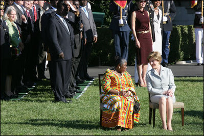 Mrs. Laura Bush and Ghana's first lady Theresa Kufuor sit together on the South Lawn of the White House during the South Lawn Arrival Ceremony Monday, Sept. 15, 2008, on the South Lawn of the White House.