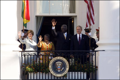 President George W. Bush and Mrs. Laura Bush, joined by President John Agyekum Kufuor and Mrs. Theresa Kufuor of Ghana, acknowledge the crowd Monday, Sept. 15, 2008, following the South Lawn Arrival Ceremony for President Kufuor and Mrs. Kufuor of Ghana at the White House.