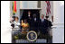 President George W. Bush and Mrs. Laura Bush, joined by President John Agyekum Kufuor and Mrs. Theresa Kufuor of Ghana, acknowledge the crowd Monday, Sept. 15, 2008, following the South Lawn Arrival Ceremony for President Kufuor and Mrs. Kufuor of Ghana at the White House.