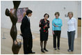 Mrs. Laura Bush is given a tour of the Nasher Sculpture Center by Acting Chief Curator Jed Morse, left, Trustee Nancy Nasher, second from left, and Debbie Francis, right, on Friday, Sept. 19, 2008, in Dallas.