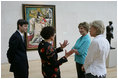 Mrs. Laura Bush stops in front of Pablo Picasso's painting 'Nude Man and Woman' as she is given a tour of the Nasher Sculpture Center by Acting Chief Curator Jed Morse, left, Trustee Nancy Nasher, gesturing, and Debbie Francis, right, Friday, Sept. 19, 2008 , in Dallas.