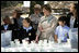 Mrs. Laura Bush and children from the Adam Clayton Powell Jr. Elementary School (P.S. 153) and the Boys and Girls Club of Harlem do 'cup planting' as part of the First Bloom program at the Hamilton Grange National Memorial in New York City, Sept. 24, 2008. The children will take care of the seedlings in the cups throughout the winter and plant them in the park in the spring.