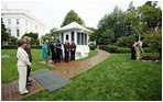 President George W. Bush and Mrs. Laura Bush watch their daughter Jenna Hager and son-in-law Henry Hager plant a Cherokee Princess Dogwood during a commemorative tree planting ceremony Saturday, Sept. 27, 2008, on the South Lawn of the White House.